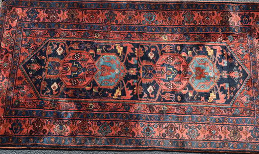 PERSIAN ORIENTAL AREA RUG: Ca 1920's. Dark blue center ground. Multi medallions in center. Four borders. Center borders with alternating design. 6 feet 6 inches x 3 feet x 6 inches. Good condition.