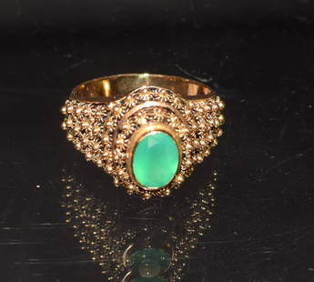 18K YELLOW GOLD PORTUGAL EMERALD RING: Hallmarked with 800 marks. Oval shape emerald approx. 1 1/4 carat. Ring size 8. Approx. 4.4 DWT. Good condition.