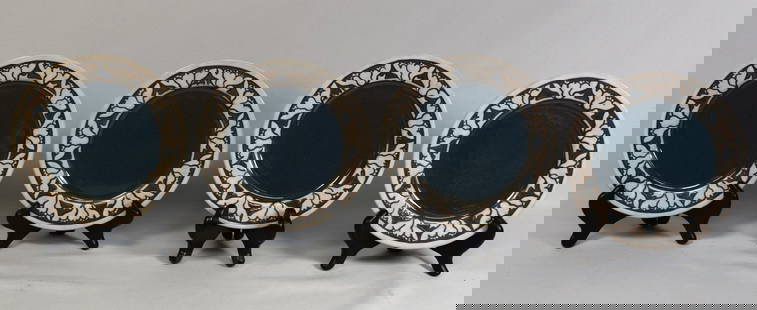 (on-4) SEG ART POTTERY PLATES: Consists of 4 plates. Saturday Evening Girl's Paul Revere Pottery plate with lotus border decoration. 7 1/2 inches diameter. Lotus flower border. Ca 1910. Fine condition.