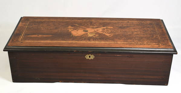 SWISS 10 TUNE MUSIC BOX WITH INLAID CASE: Swiss cylinder 10 tune music box, housed in a rosewood case having an ebonized trim with inlay to the lid. Glass door houses cylinder frame and complete steel comb and is flanked by the windingarm and