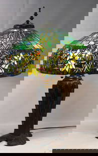 CONTEMPORARY TIFFANY STUDIOS STYLE LAMP WHEAT BASE: Fine Tiffany style leaded glass table lamp. Detailed blue and green mosaic and bronze wheat design over pottery base. Large tapered dome shade with blue, green and purple top, colorful widestylized ba
