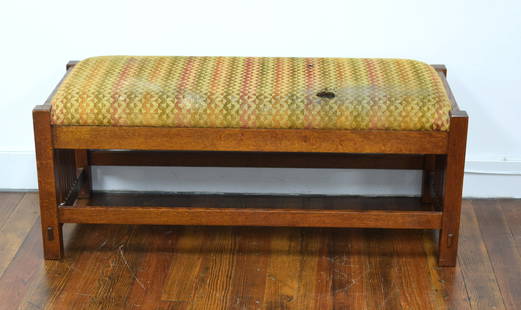 STICKLEY SPINDLE ARTS & CRAFTS MISSION OAK BENCH: Ca 2ist century. Contemporary spindled bench, Manilus, NY. Cushion insert top and spindle sides. Branded marks and metal tags. Dimensions: 17" x 42" x 18" Burn holes on top cushion. As is.