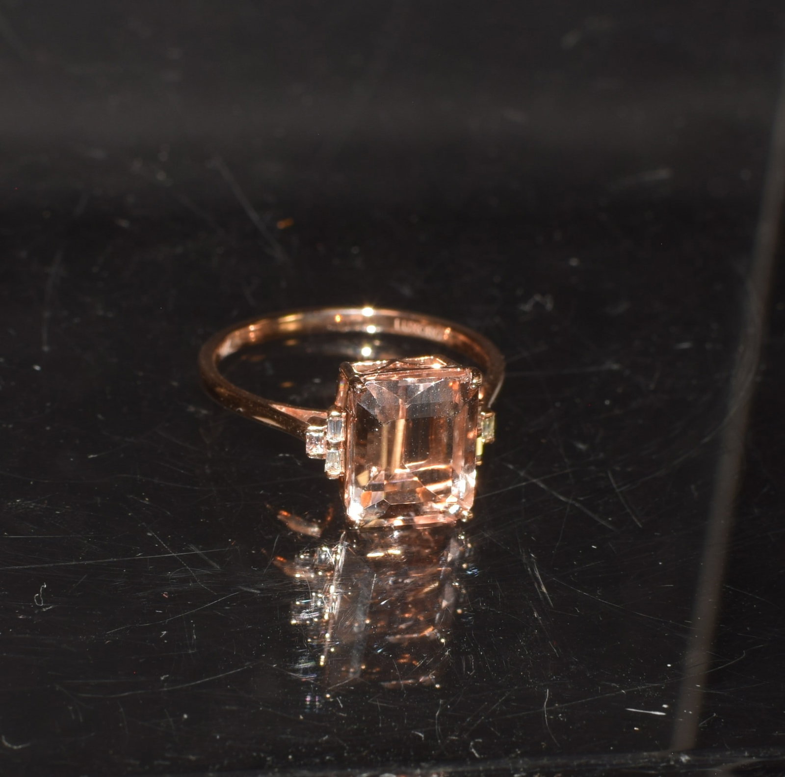 14KT ROSE GOLD MORGANITE & DIAMOND RING: 14kt rose gold set with King Octagon Morganite approximately 3.89 cts. Diamond accents each side approximately. 11 cts. Ring size 9 3/4. Item code # 7158686 with Certificate. Approximate 2.3 dwt.Good