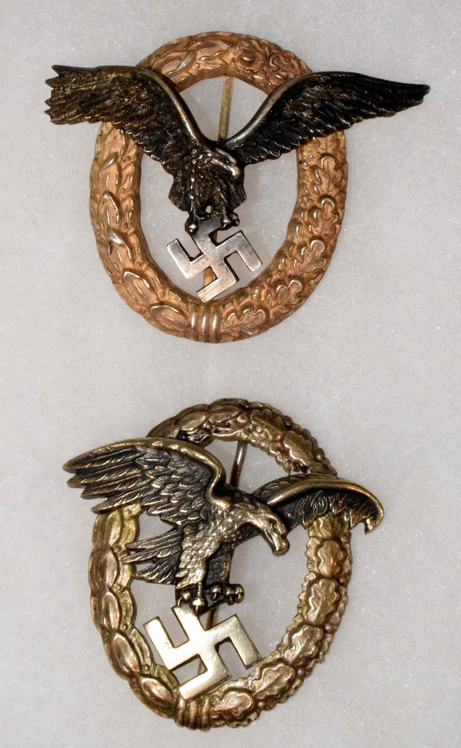 (on-2) WWII GERMAN LUFTWAFFE PILOTS OBSERVER BADGE: (on-2) pieces. Estate collection of William Bureau of WWII Third Reich Military. 1) World War 2 German Luftwaffe pilots observers badge, features wreath design with eagle symbol in the center,vertical
