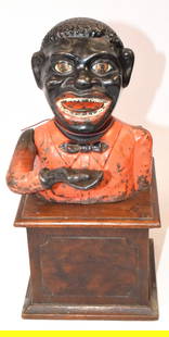 JOLLY MECHANICAL CAST IRON BANK WITH WOOD BASE: Original Jolly cast iron mechanical bank attrib. to John Harper & Co. England with walnut wooden base with key. Nice condition. Working. 11 1/2 inches tall x 6 inches wide x 6 1/2 inches deepand 6 pou