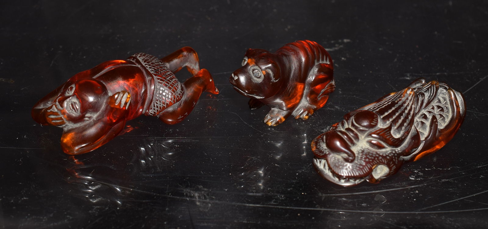 JAPANESE AMBER NETSUKE CARVINGS (1 of 7)
