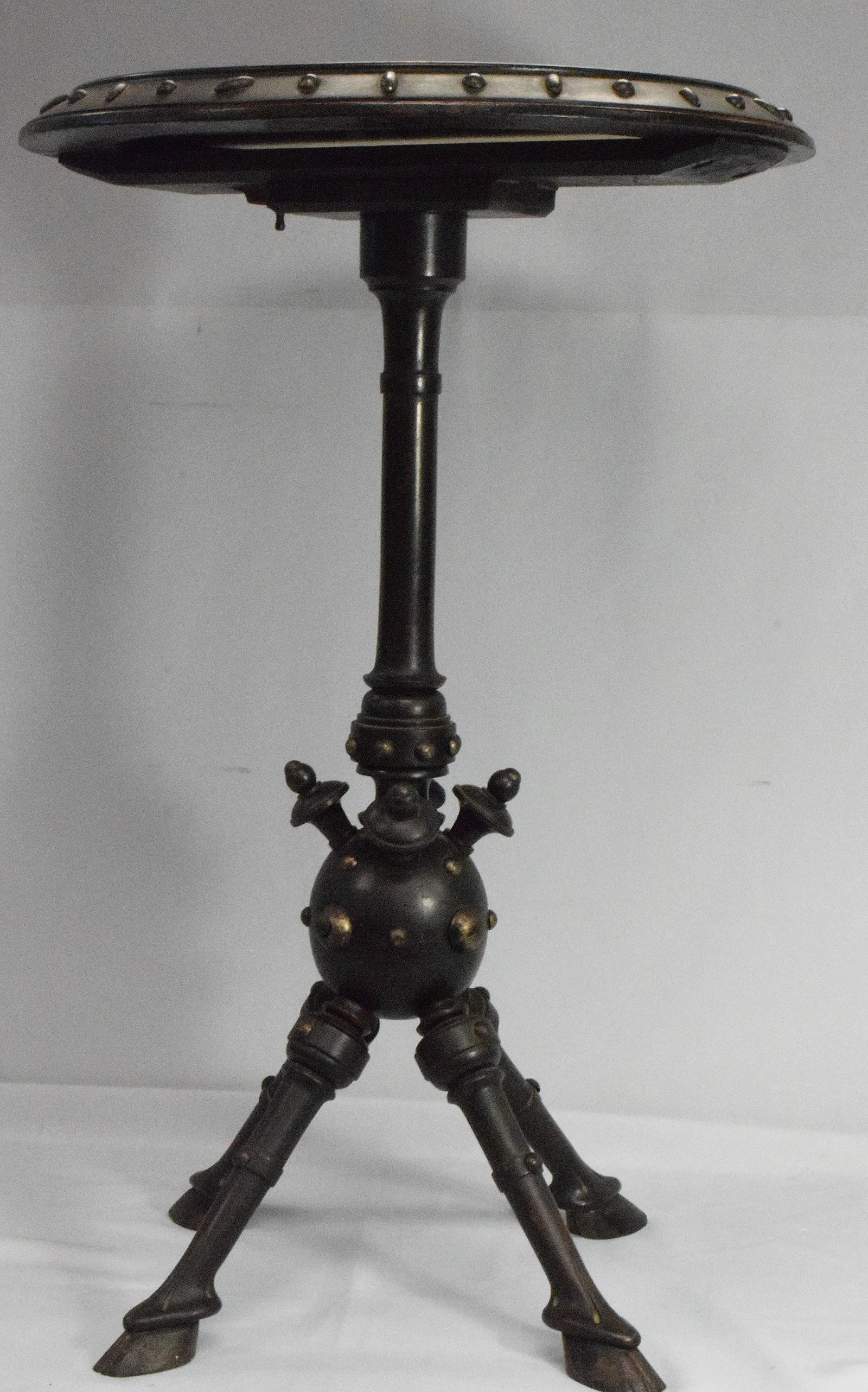 UNUSUAL VICTORIAN MARBLE TOP ACCENT TABLE: Round white marble with carved wide frame. Ornate carved walnut base with 4 angled legs with carved horse hoff feet. Measures 0ver all 19 inches in diameter with a 15 1/2 inches diameter marbleinsert 