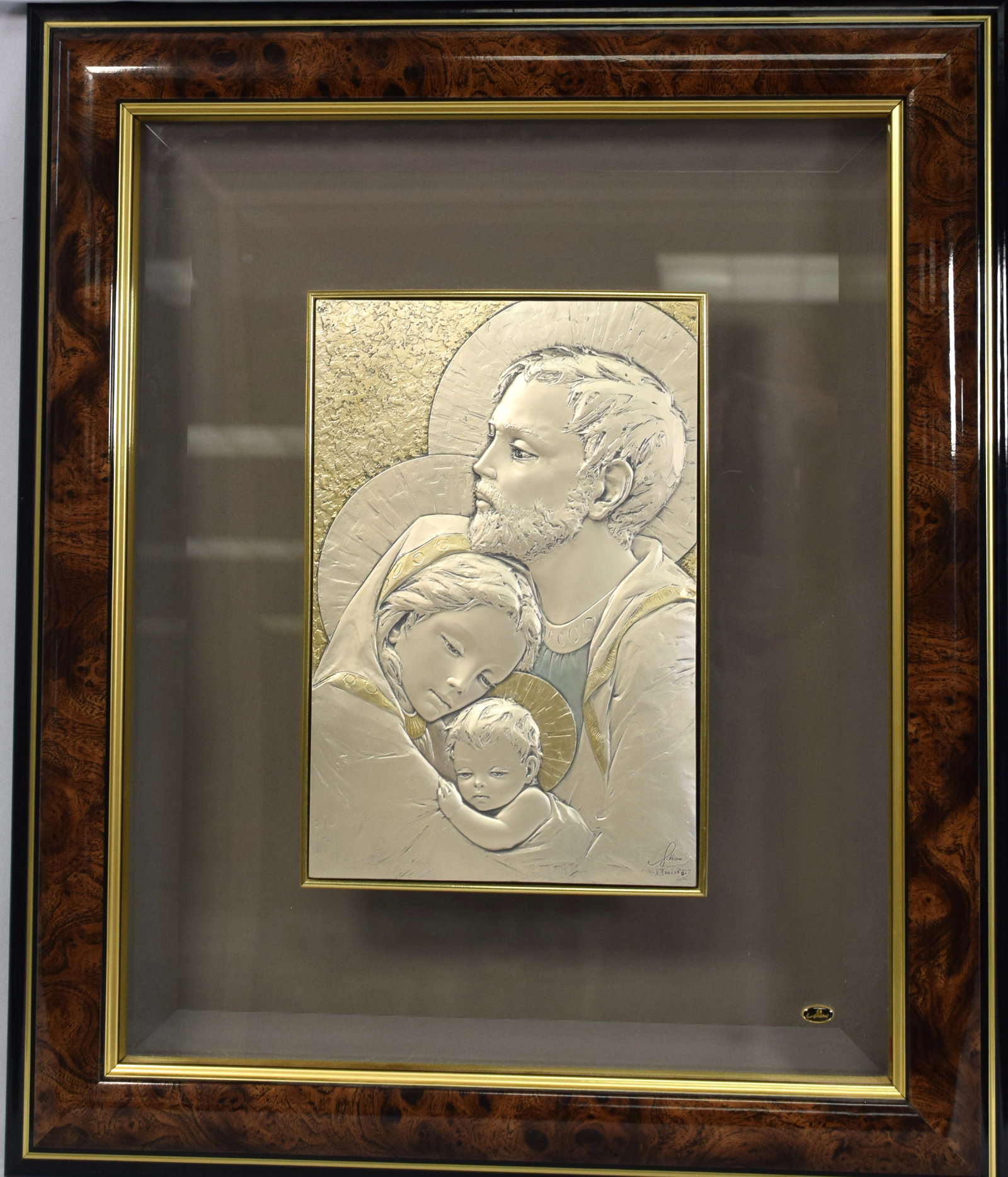 FRAMED STERLING HOLY FAMILY PLAQUE: Signed and marked Jalerui. .925 sterling plaque. Plaque 7 x 10 1/2 inches. Mounted on bevel glass. Frame 18 inches x 21 1/2 inches. Shipping 9 pounds. Good condition.