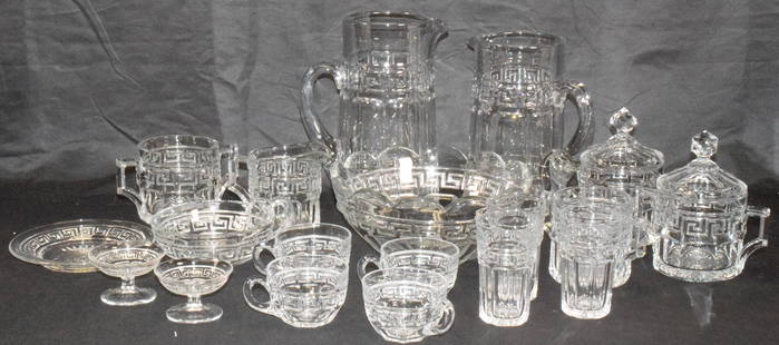 19 ASSEMBLED HEISEY GREEK KEY PATTERN GLASS: Various assembled pieces. 1) Two pitchers. Both with H diamond mark. 9' and 8 inches. The tall one with minor surface wear or scratches. 2) 8 12/ inch diameter bowl. 3) Creamer and sugar. 4) Twocover