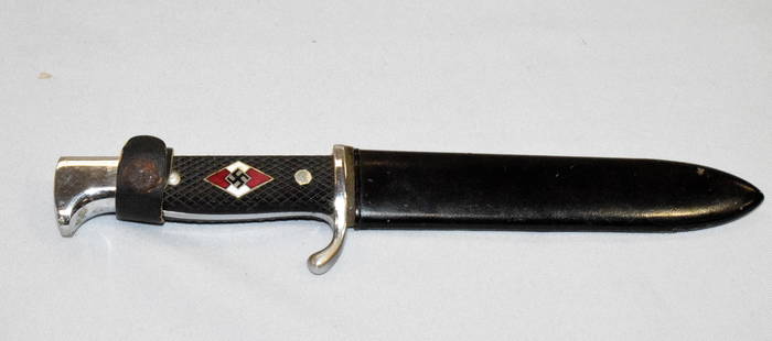 WW2 GERMAN YOUTH KNIFE: RZM 17/2 1937 German youth dagger with sheath. World War Etched blade. 10 inches long. Minor surface rust on blade. Some loss on sheath. Good condition.