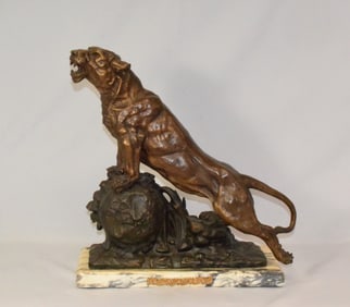 BRONZED LIONESS ON WHITE MARBLE BASE FIGURE.
