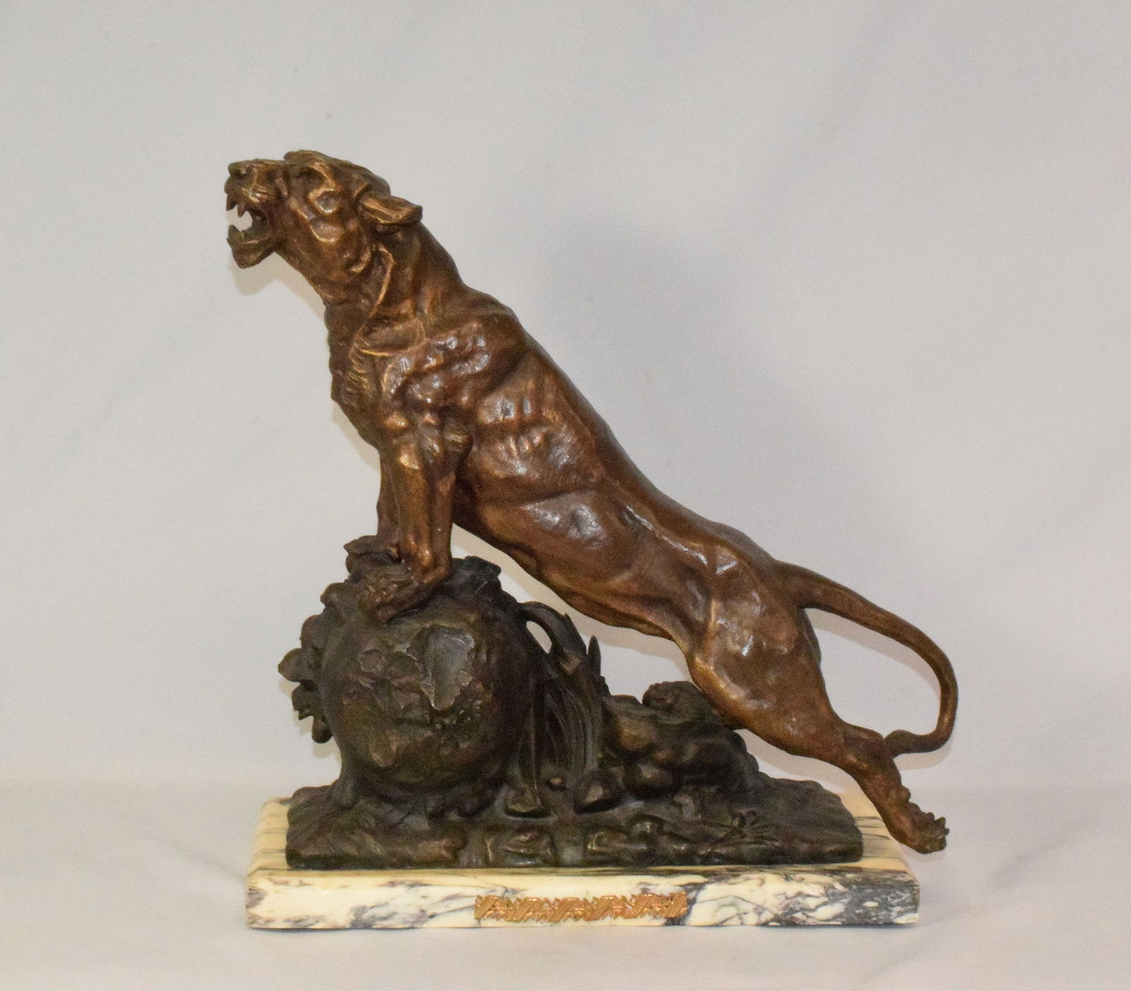 BRONZED LIONESS ON WHITE MARBLE BASE FIGURE. (1 of 6)