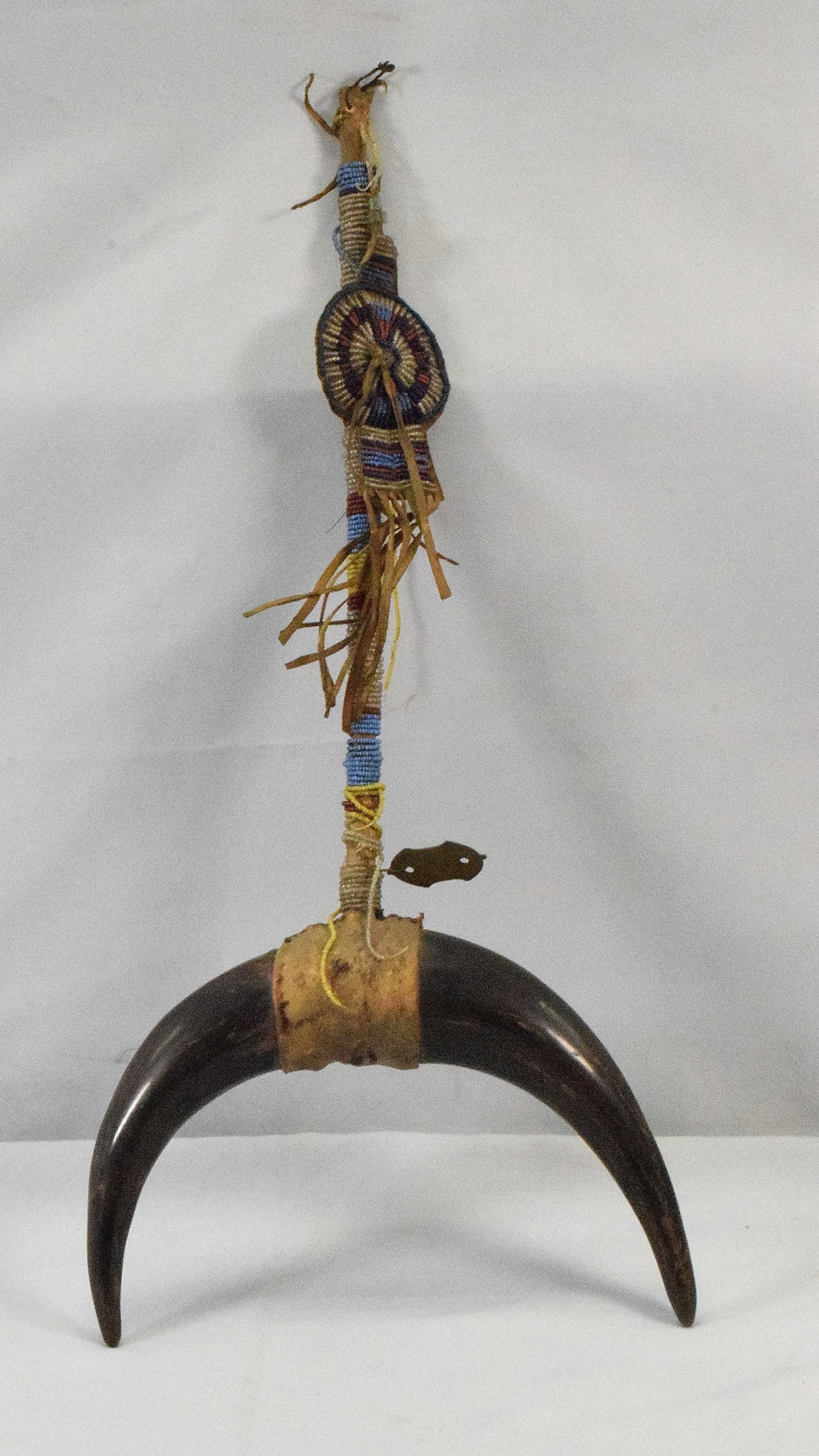 19TH/20TH PLAINS DANCE CEREMONIAL WAND: 19th Plains Indian wand. Beaded staff or handle with hanging beaded piece. Buffalo horn top. Hide backing. some beaded work is loose. 26 inches long. Original untouched condition. Shipping weight appr