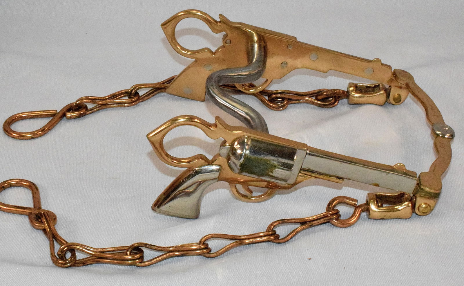 NORTH & JUDD FIGURAL COLT PISTOL HORSE CURB BIT: Fine quality eye catching North & Judd "Bill Cody" Figural Colt pistol horse bit. Shape like miniature Colt revolvers. 3-dimensional Hercules bronze and nickel plating. Curb mouthpiece, lip bar and or