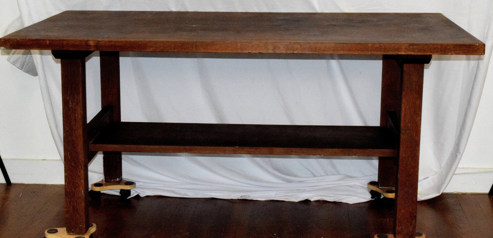 GUSTAV STICKLEY OAK RECTANGLAR LIBRARY TABLE #623: Gustav Stickley Arts andCrafts Mission style oak table, circa 1907-1912. Remnants of the original label on underside . "H" shaped stretcher. Mortised and pegged construction. Original finish has wear