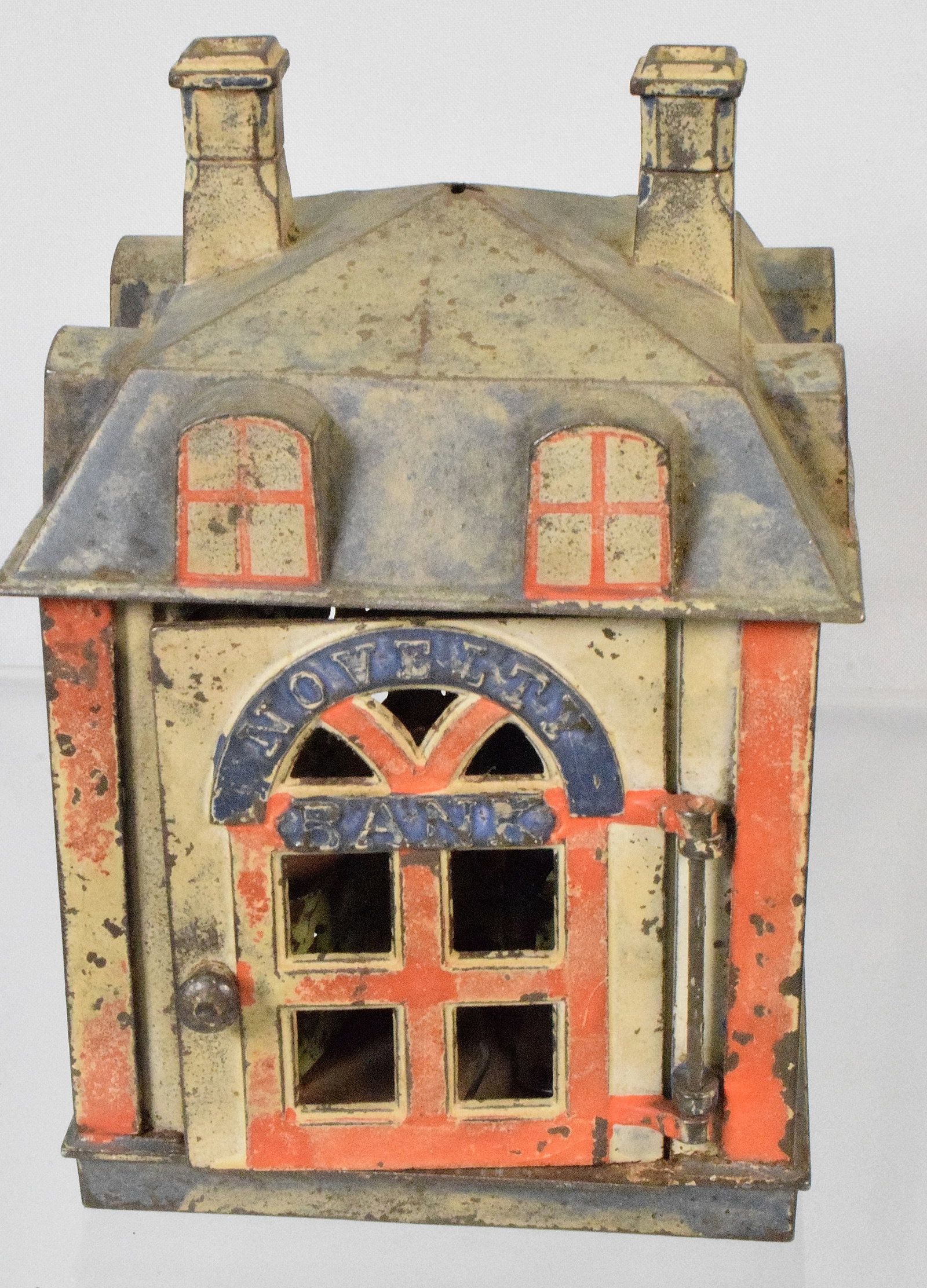 J. & E.STEVENS CAST IRON NOVELTY BANK: J & E Steven cast iron mechanical "Novelty Bank" . Pat. 1872/1873. Original red, white and blue paint. Door opens and figure of man swings out. Measures 4 3/4 inches x 4 3/4 inches by 7 inches tall to