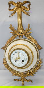 19TH FRENCH MARBLE & BRONZE CARTEL CLOCK: Antique Louis XVI style Face signed by retailer Bigelow, & Kennard & Co. Boston. Hanging wall white marble & gilt bronze Cartel clock. Enamel face face with convex dome glass hinged cover. Face decora