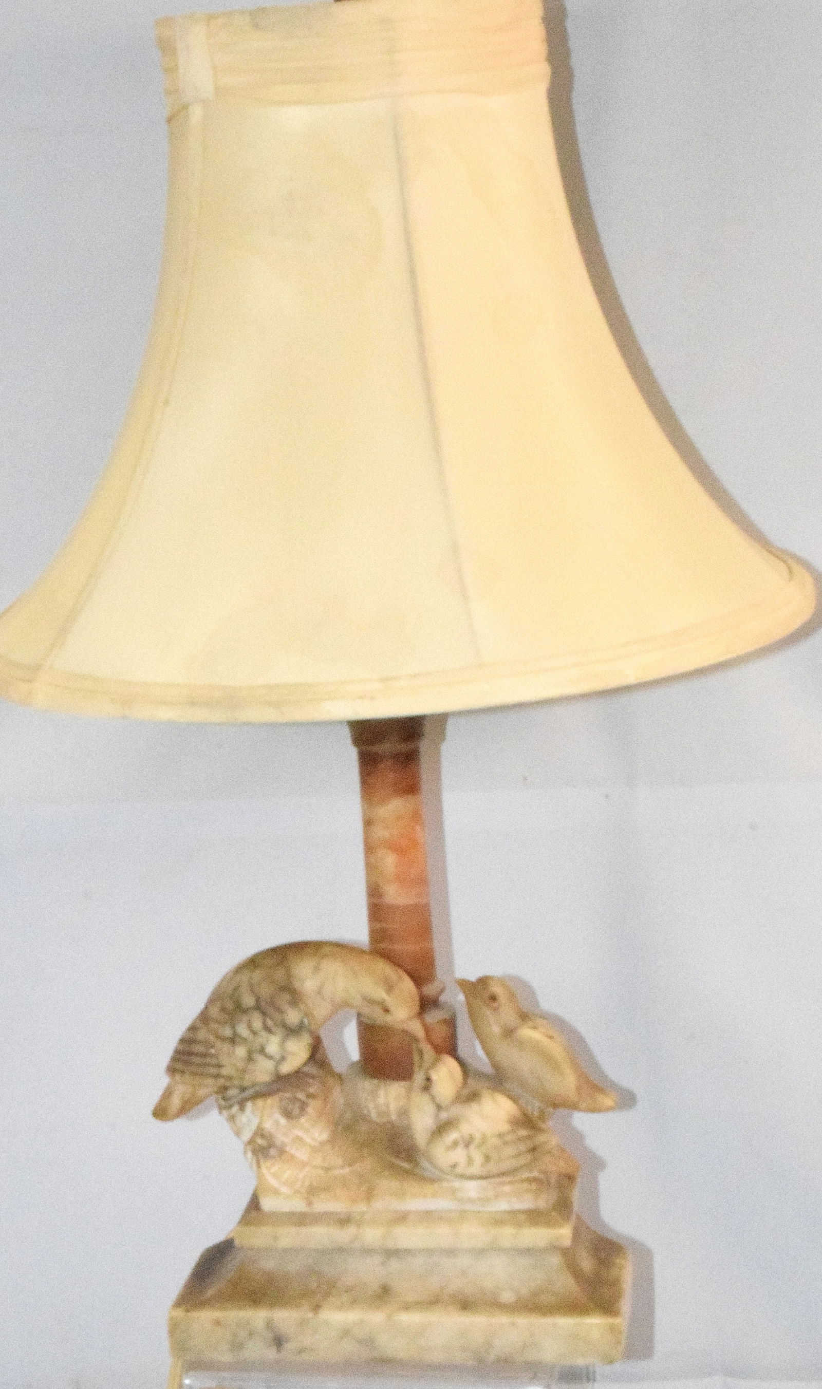 CARVED ALABASTER FIGURAL BIRD TABLE LAMP: Ca 1910-1920's. Carved alabaster lamp with mother bird feeding chicks. Original condition. Has shade. No markings. 23 inches tall. Birds with glass eyes. Shade 14 inches diameter. Good condition. Ship