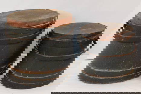 (2) 19TH CENTURY NEW ENGLAND FIRKIEN BUCKETS: Two 19th New England sugar or firkin buckets. Soft wood staved construction with bailed handles and finger joint bands. Chips and overall usage, still having original dark green color. One is smallert