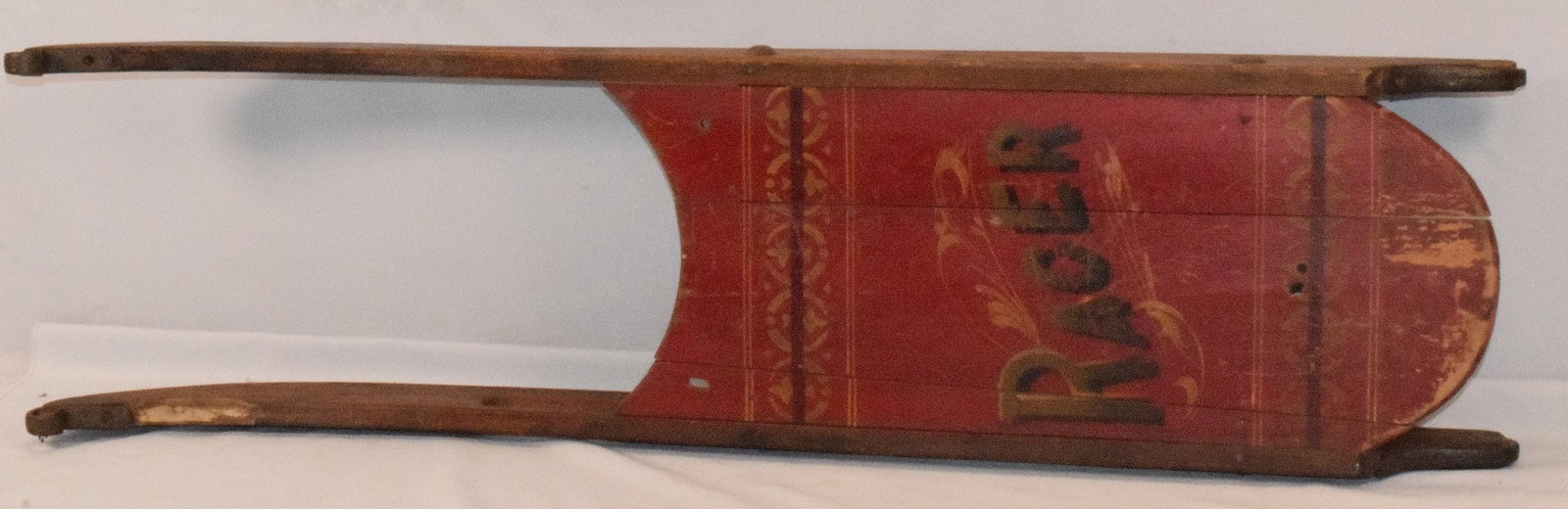 19TH C VICTORIAN WOOD RACER SLED.: Ca 19th century. New England. Painted racer with iron runners. 40 1/2 inches long 10 1/2 inches wide. In Some wear. Original paint. Original lettering. Shipping weight 10 LBS
