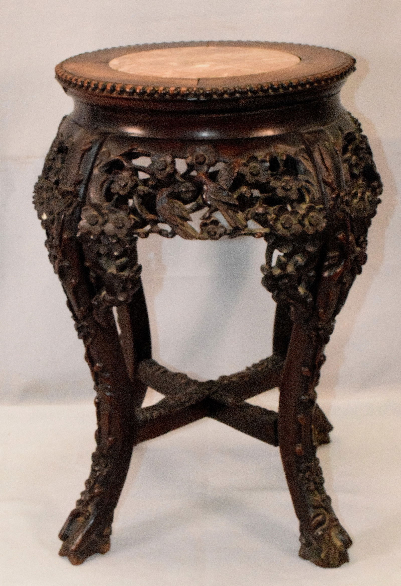CHINESE CARVED WOOD & MARBLE FERN STAND: Ca 19th /20th century. Chinese jardiniere or fern stand. Dark carved hardwood with round marble insert. 19 1/2 inches tall. Good condition. Shipping weight approx. 8 pounds.
