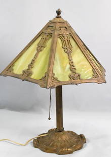 BRADLEY & HUBBARD SIX PANEL SLAG GLASS LAMP: Signed Bradley & Hubbard Arts & Crafts 6 panel lamp. Green slag glass angled panels. Overlay with ornate urn and sunflower panel design. Metal base signed and numbered 2126. Bronzed finish molded leaf