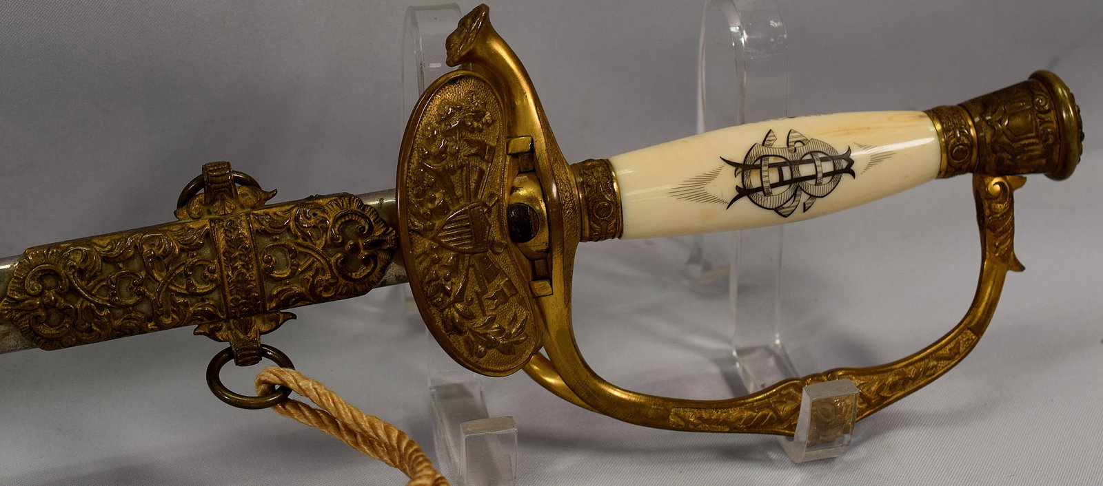 19TH CENTURY GAR PRESENTAION SWORD: 1895 GAR presentation sword and sheath, both in steel with brass decorations and a brass and bone handle monogrammed GAR on one side and SAB on the other,by Horstmann Philadelphia. Sheath isinscribed