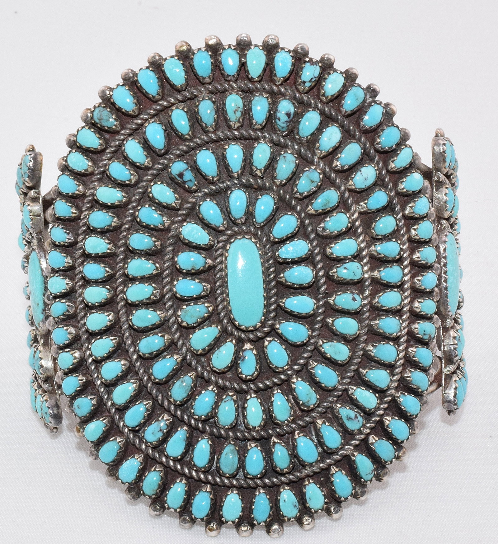NAVAJO TURQUOISE & SILVER CLUSTER CUFF BRACELET: Wide Navajo sterling silver and turquoise cluster cuff bracelet, signed NEF for Norman E. Freeman, circa 1950's-1960's. Good condition. Measures approx. 7 inches wrist size. Weighs approx. 80grams, 2.