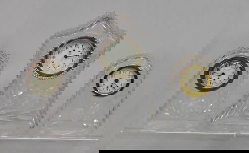 (3) PAIRPOINT GLASS TABLE CLOCKS: Consist of three. 1) New Haven clock. 8 inches tall x 5 1/2 inches wide x 3 inches deep. Clock is not working. 2) New Haven Clock Pairpoint beehive shape glass clock. Flower design. Clock is notworkin