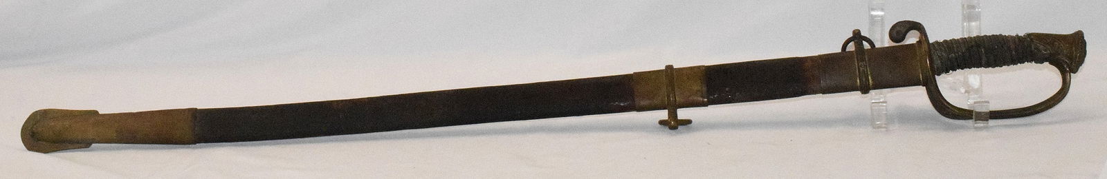 WILLIAM DIETRICH NEW YORK CIVIL WAR SWORD: Original Civil War sword with scabbard. Blade marked W, Dietrich NW. Brass guard. Wrapped leather grip. Some loose wire. Leather and brass scabbard. Some etching on blade. 37 1/2 inches.