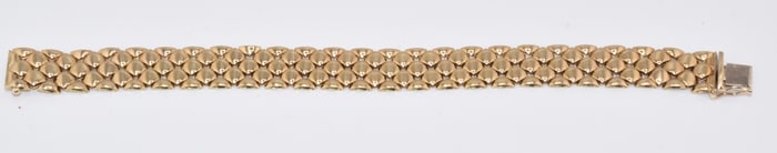 14K YELLOW GOLD WOVEN BRACELET.