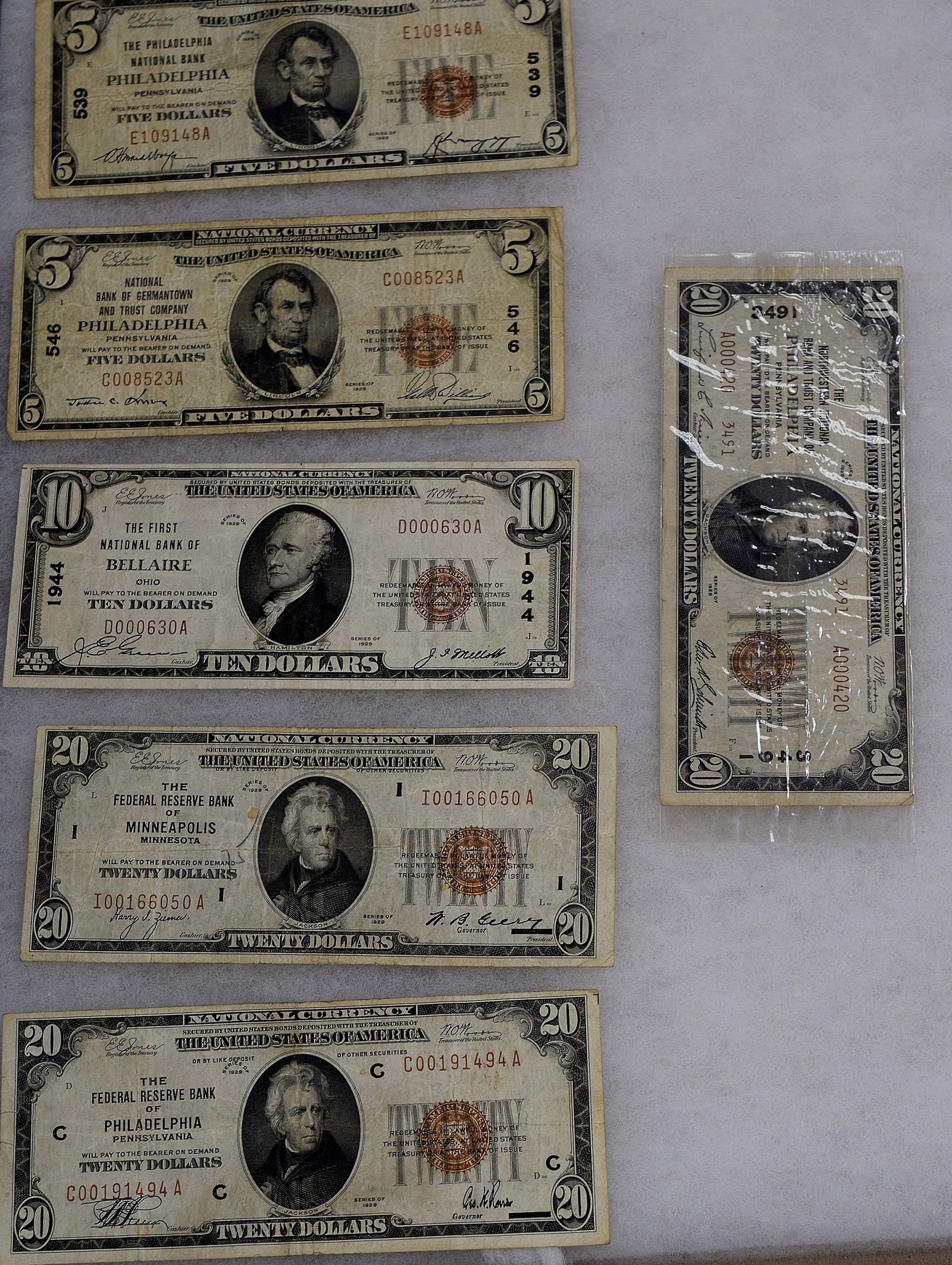 1929 US NATIONAL CURRENCY NOTES: Consists of 1) US $5 dollar notes. 1929 Philadelphia, 1929 Philadelphia note. Circulated. 2) Ohio 1929 $10 dollar note. 3) Three 1929 Minnesota $20 dollars. Circulated. Face amount $80 dollars.