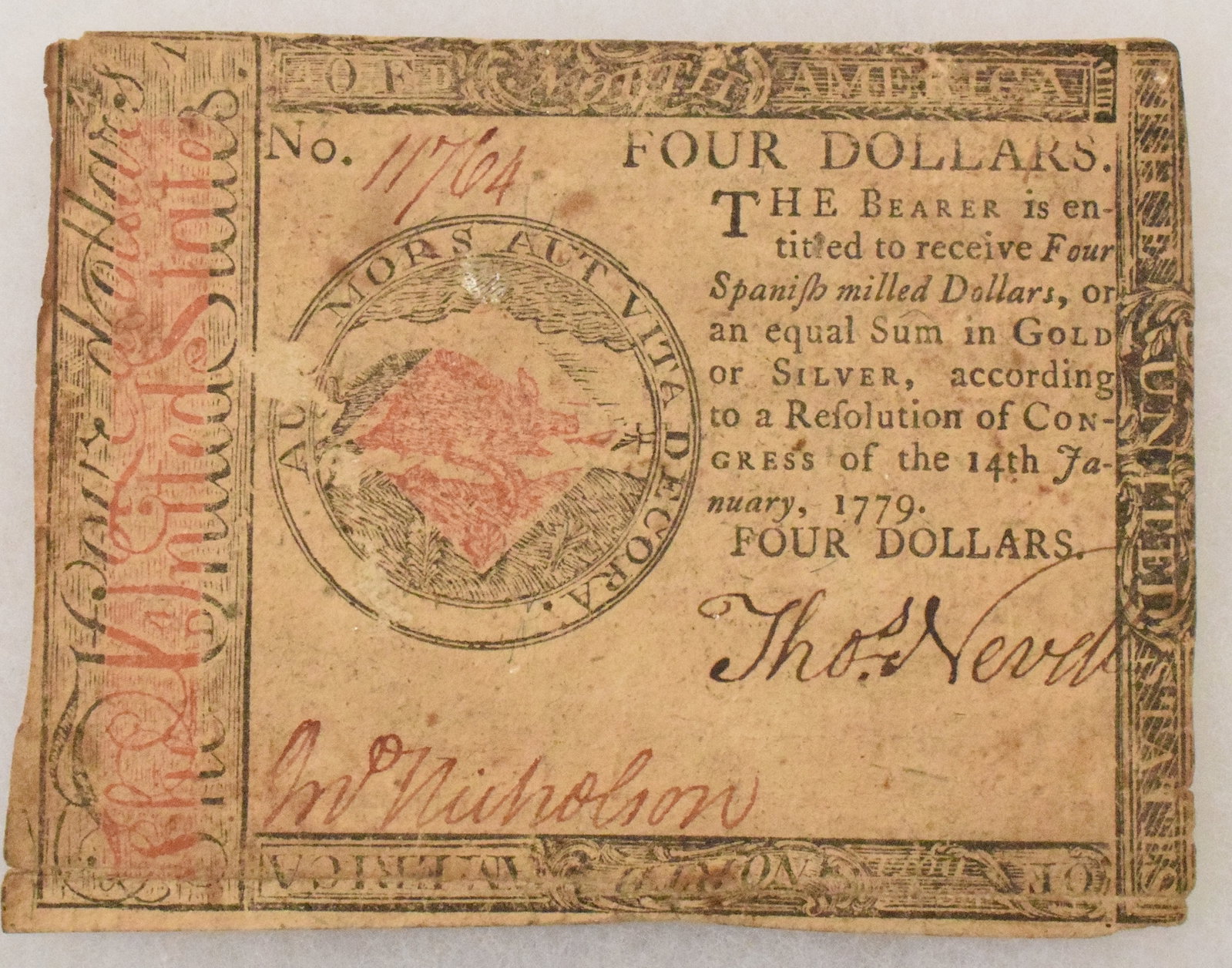 UNITED STATES CONTINENTAL FOUR-DOLLAR NOTE: 1779, with red overprint, printed by Hall & Sellers, Philadelphia, PA. 1779. 3 5/8" x 2 7/8". Wear and faded with no losses or tears, folds, serial number and two signatures.