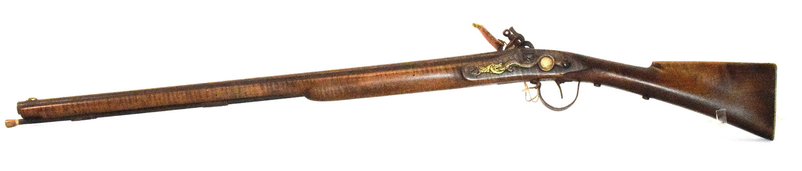 ATTRIB. DAVIDE PEDERSOLI INDIAN TRADE FLINTLOCK: Very detailed we believe reproduction Indian Trade flintlock or rifle. Age not known. 45 inches long. No visible markings. It maybe a early Davide Pedersoli Indian trade flintlock. Cut nails onbrass s
