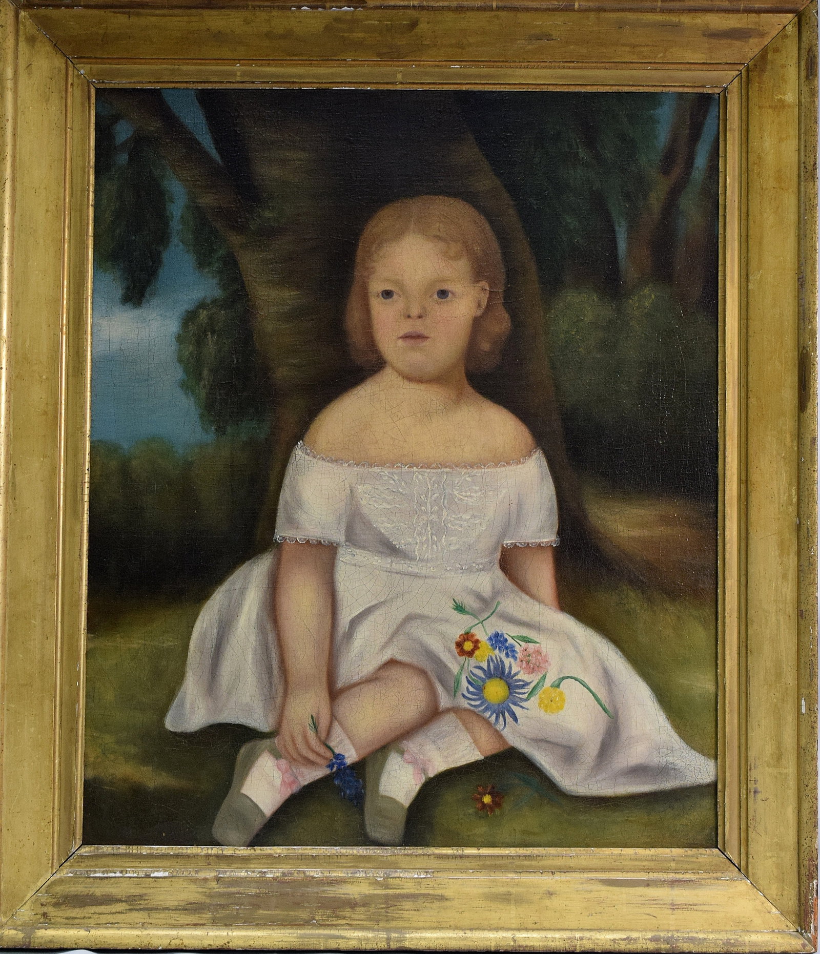 19TH AMERICAN PRIMITIVE FOLK ART CHILD PAINTING: Early 19th century American school primitive folk art oil painting of girl with flowers. Sitter is not identified. Girl sitting under tree with some flowers. Oil on canvas relined. Image 25 inches x30
