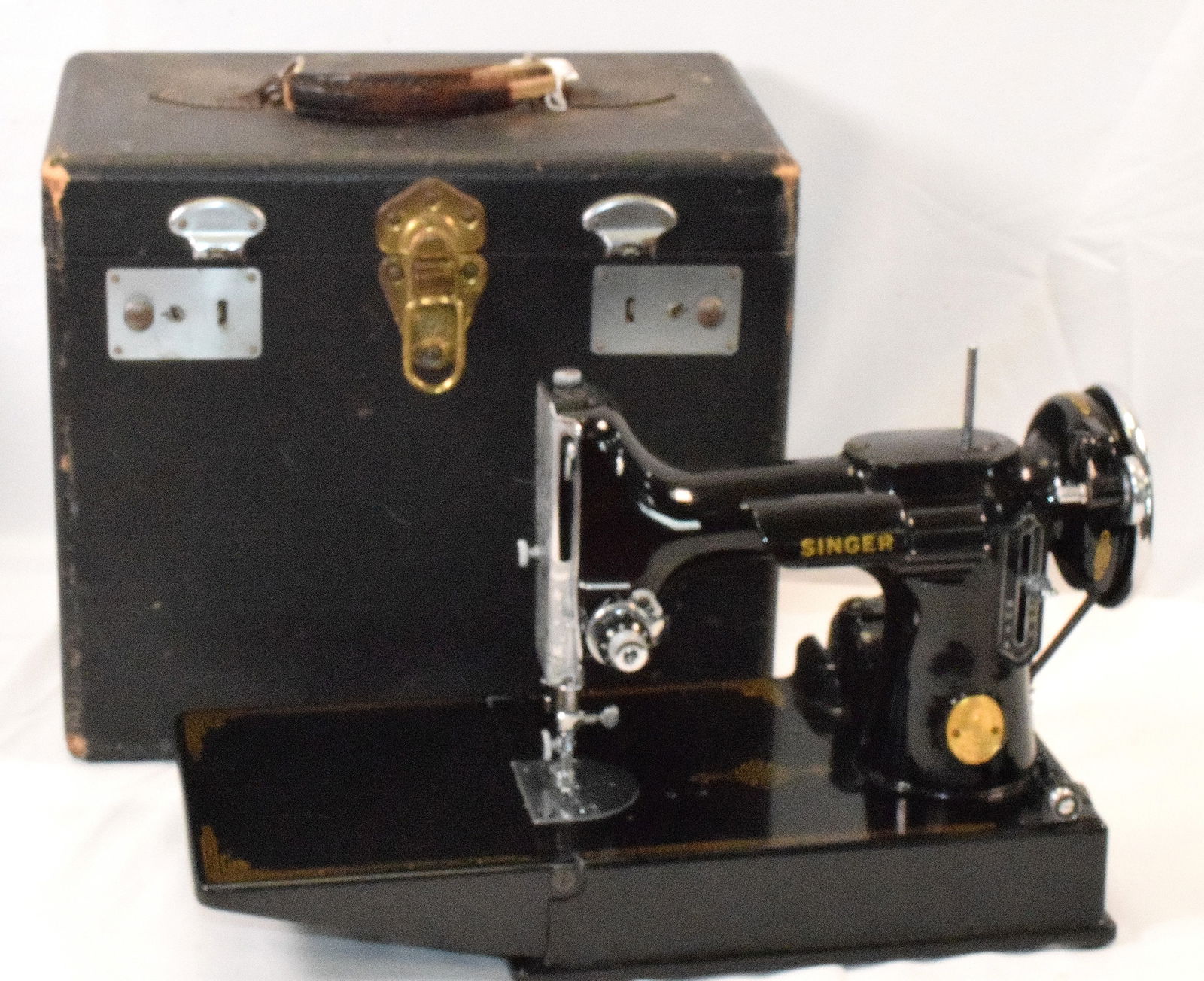 SIGNER FEATHERWEIGHT SEWING MACHINE: Set comes with original sewing machine, tray on top for accessories. singer box for accessories and instruction manual. Foot pedal has new cord attached, set includes old cord. Has serial number "AG80