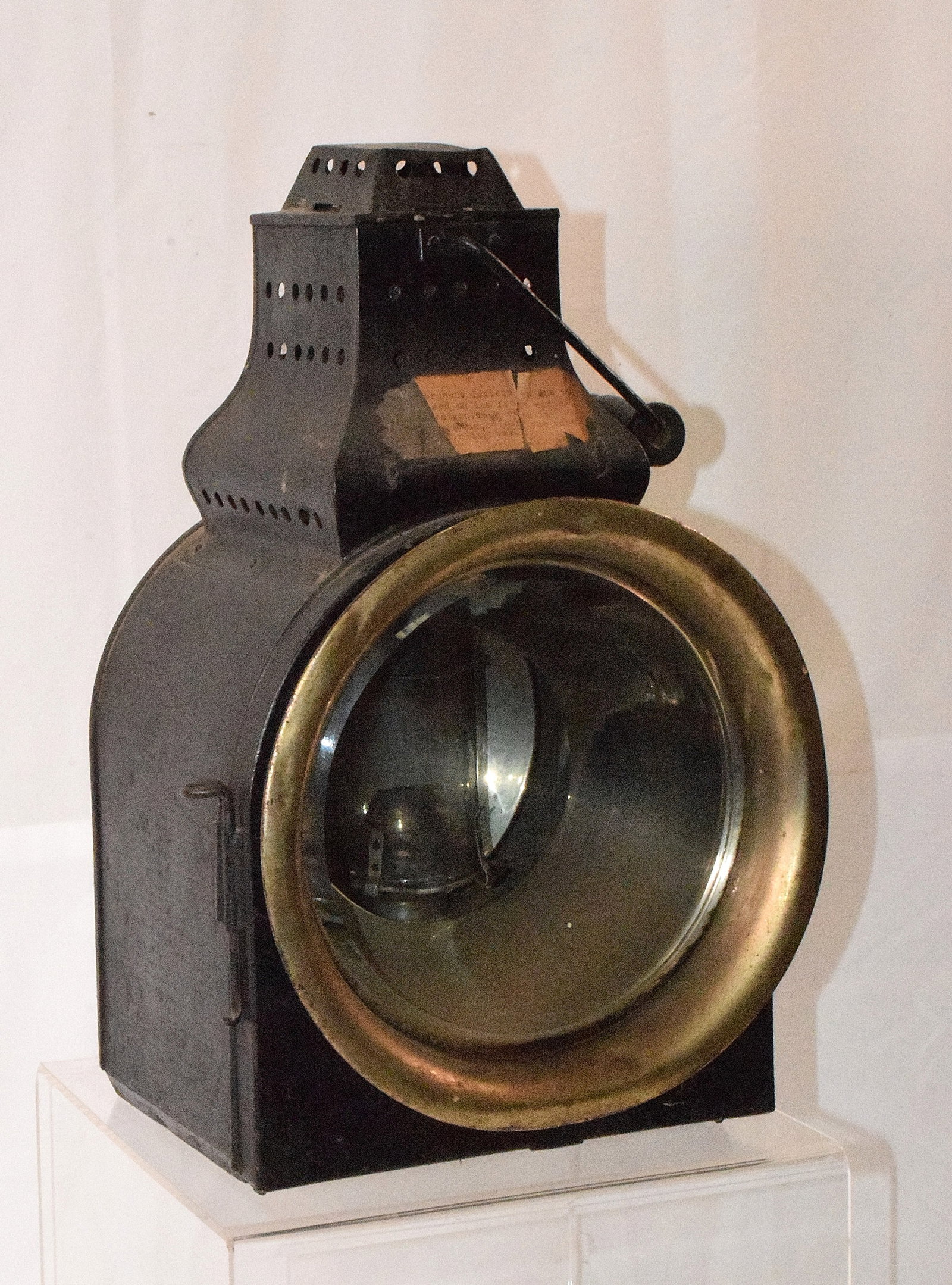 ANTIQUE PETER GRAY RAILROAD LANTERN: Peter Gray Railroad lantern. Bail handle with rear mount. Original painted black surface. 16 inches tall. Original interior. Glass shade with crack.