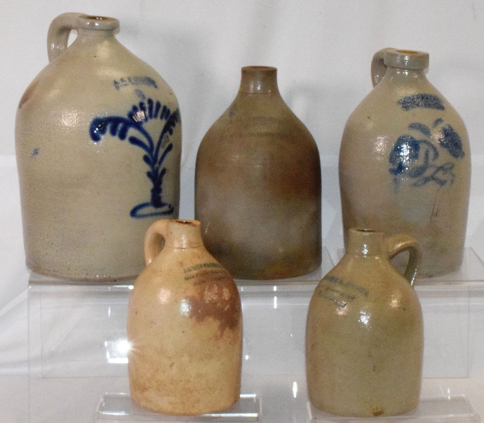 (5) BEDFORD STONEWARE COBALT JUGS: Grouping consists are all from New Bedford Mass. All 19th century. 1) One gallon stoneware jug. Maker James Farrell 695 Purchase St New Bedford Mass. Brown staining. 2) Joseph Souza New BedfordMass. O