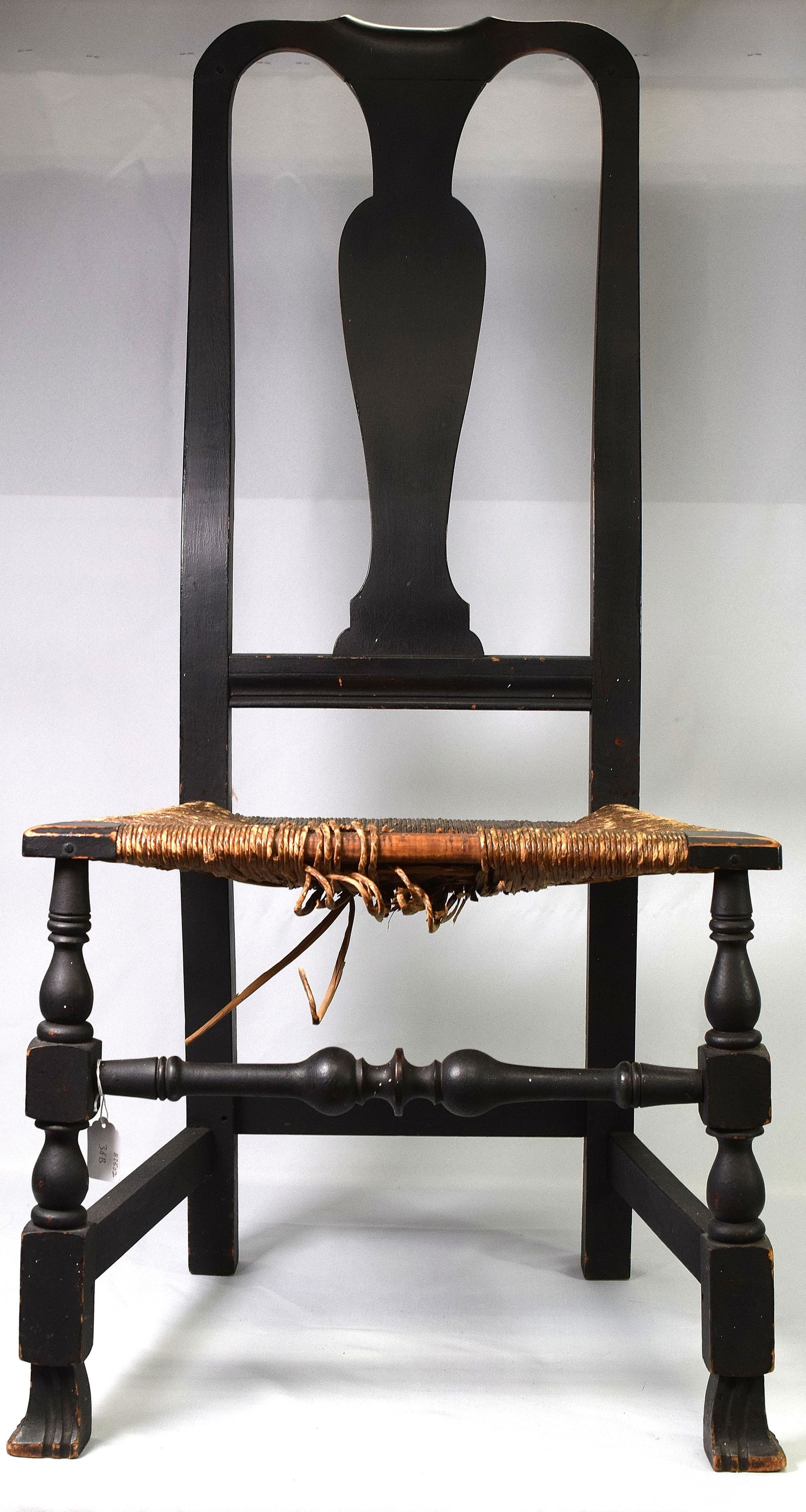 NEW ENGLAND 18TH CENTURY QUEEN ANNE SIDE CHAIR: New England Queen Anne side chair with peg construction, shaped yoke type crest, splat formed urn back, Turned leg with Spanish foot and rush seat, Turned stretcher. Original black paint, circa 1760-1