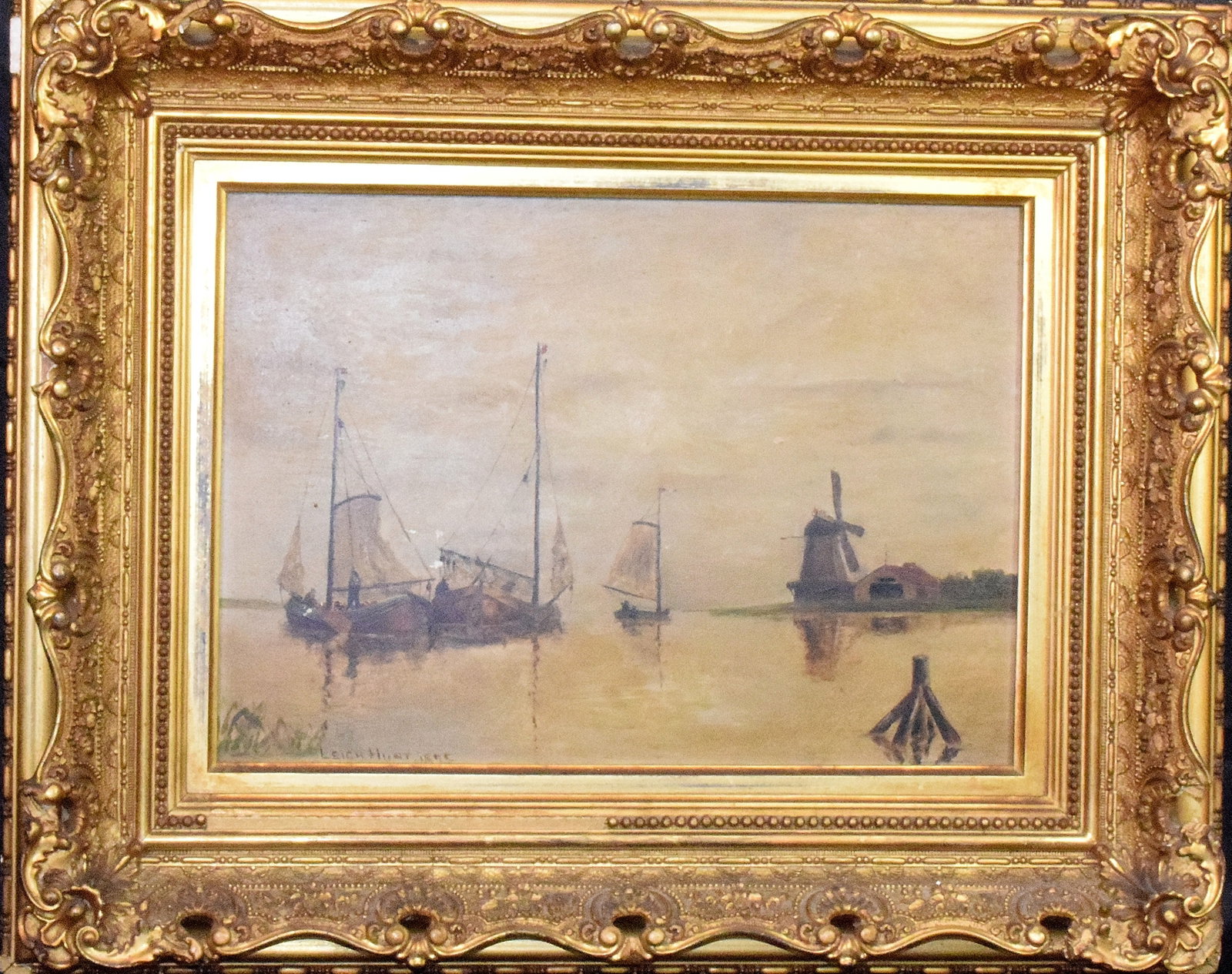 19TH/20TH LEIGH HUNT OIL PAINTING: Oil on board. Signed Leigh Hunt 1896. Image 14 inches x 10 inches. Fishing boats and windmill. Original gold gilt frame. 20 inches x 16 inches. Needs cleaning. Some scratches.