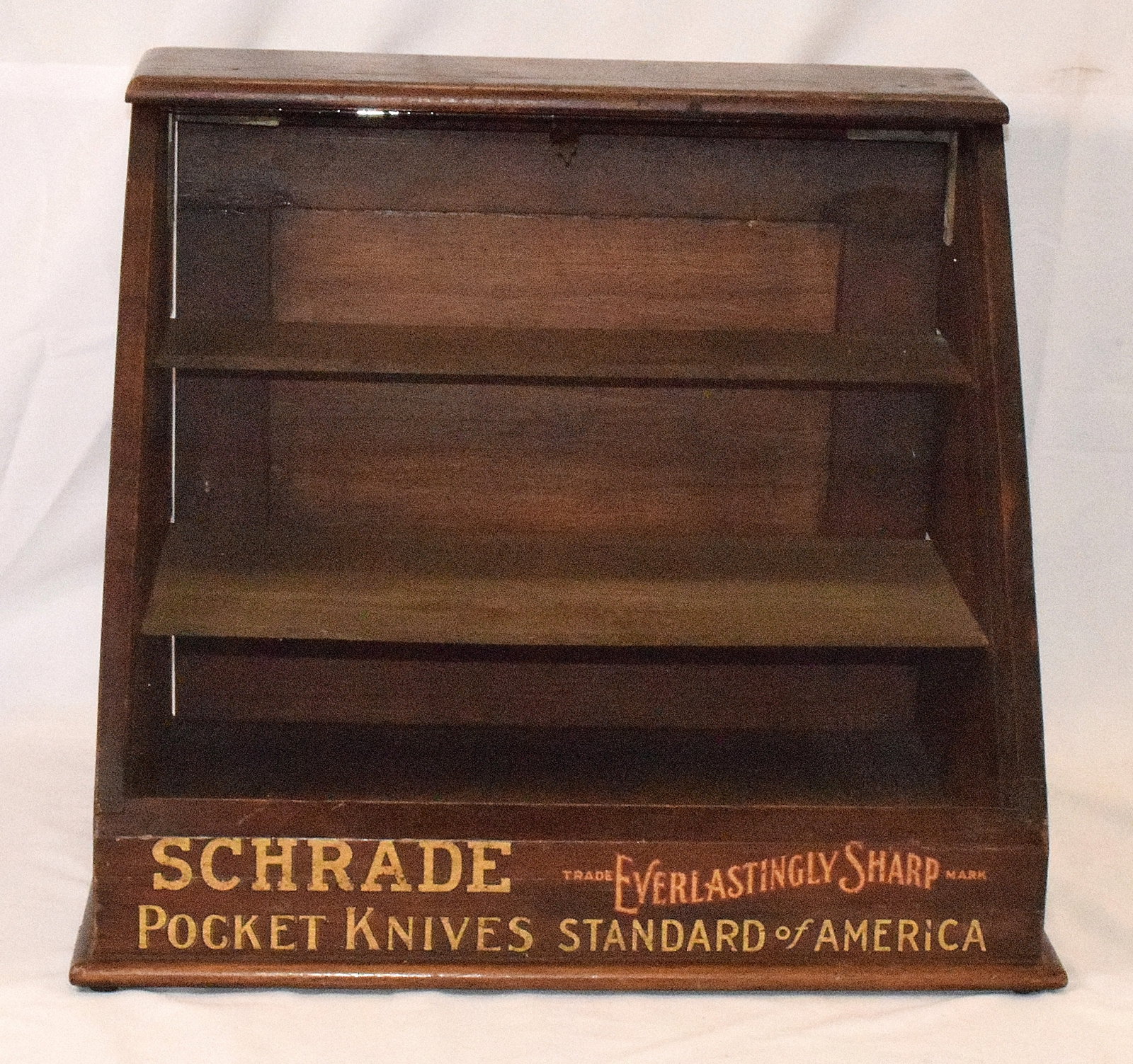 SCHRADE COUNTER TOP ADVERTISING DISPLAY CASE: Ca late 19th century. Original bottom letter stenciling. 14 inches tall x 17 inches wide x 15 inches deep.