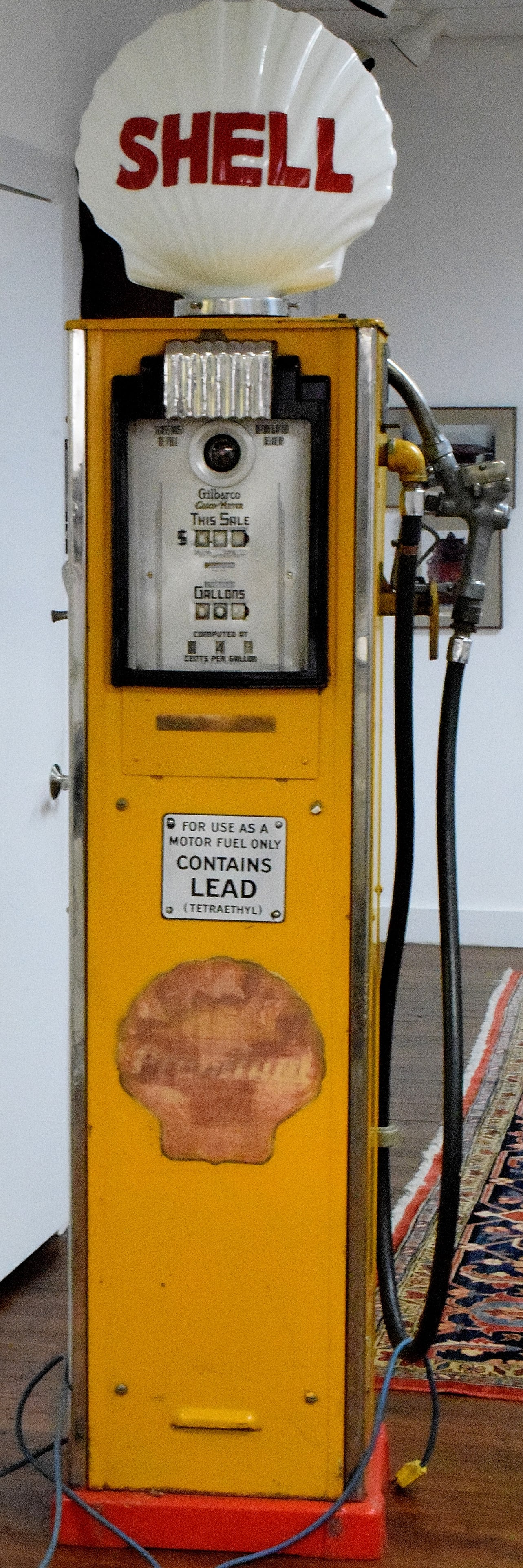 1930'S SHELL GILBARCO CALCO-METER GAS PUMP: Doubled side. Red and yellow, 20 inches x 14 inches x 86 inches tall in top of globe. Paint and decals are original and the bottom red is newer. Pump not restored. Missing glass on one side.Missing a