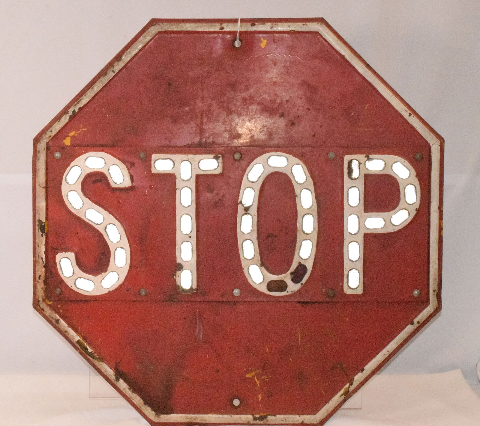 VINTAGE METAL ONE SIDE STOP SIGN: Vintage red stop sign with reflectors. 8 sided. Red over yellow. Missing two reflectors. 24 inches. Shipping approx. 15 pounds.