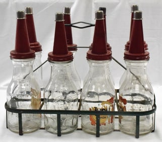 VINTAGE AUTOMOTIVE OIL BOTTLES IN METAL HOLDER