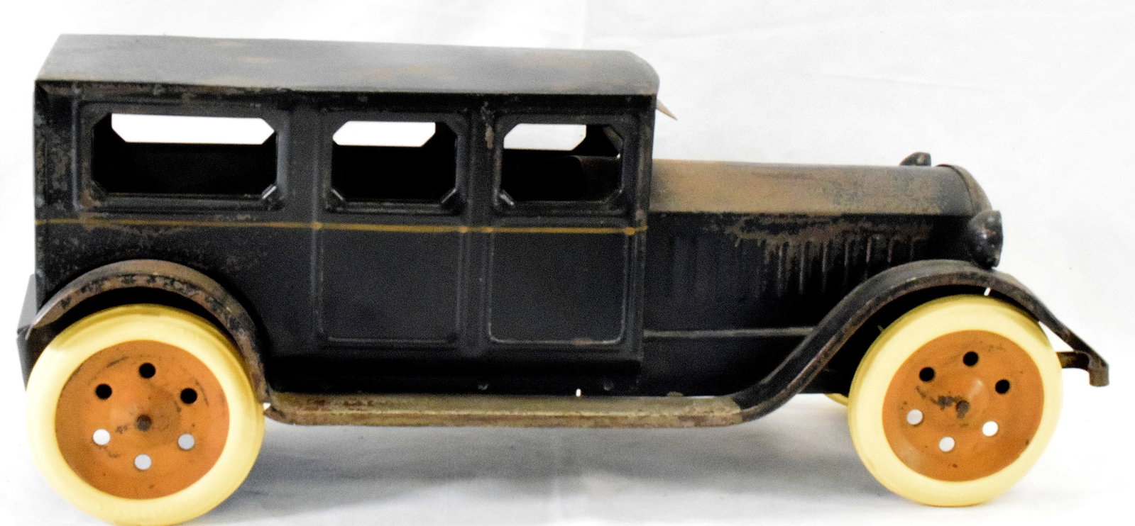 SCHIEBLE 1920's/30's PRESSED STEEL SEDAN: Schieble Toys, Dayton, Ohio. Limousine style sedan in original unrestored condition. Flywheel driven friction. Dark blue with grey running boards. Firestone period correct tires, possible replaced, ta