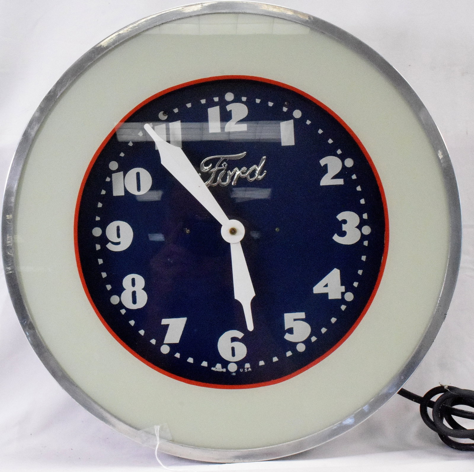 FORD NEON ELECTRIC ADVERTISING CLOCK: Vinatage 1960's-70's. Round Ford advertising clock. 20 inches diameter. Blue background with red stripe and white neon light. Good condition. Working.