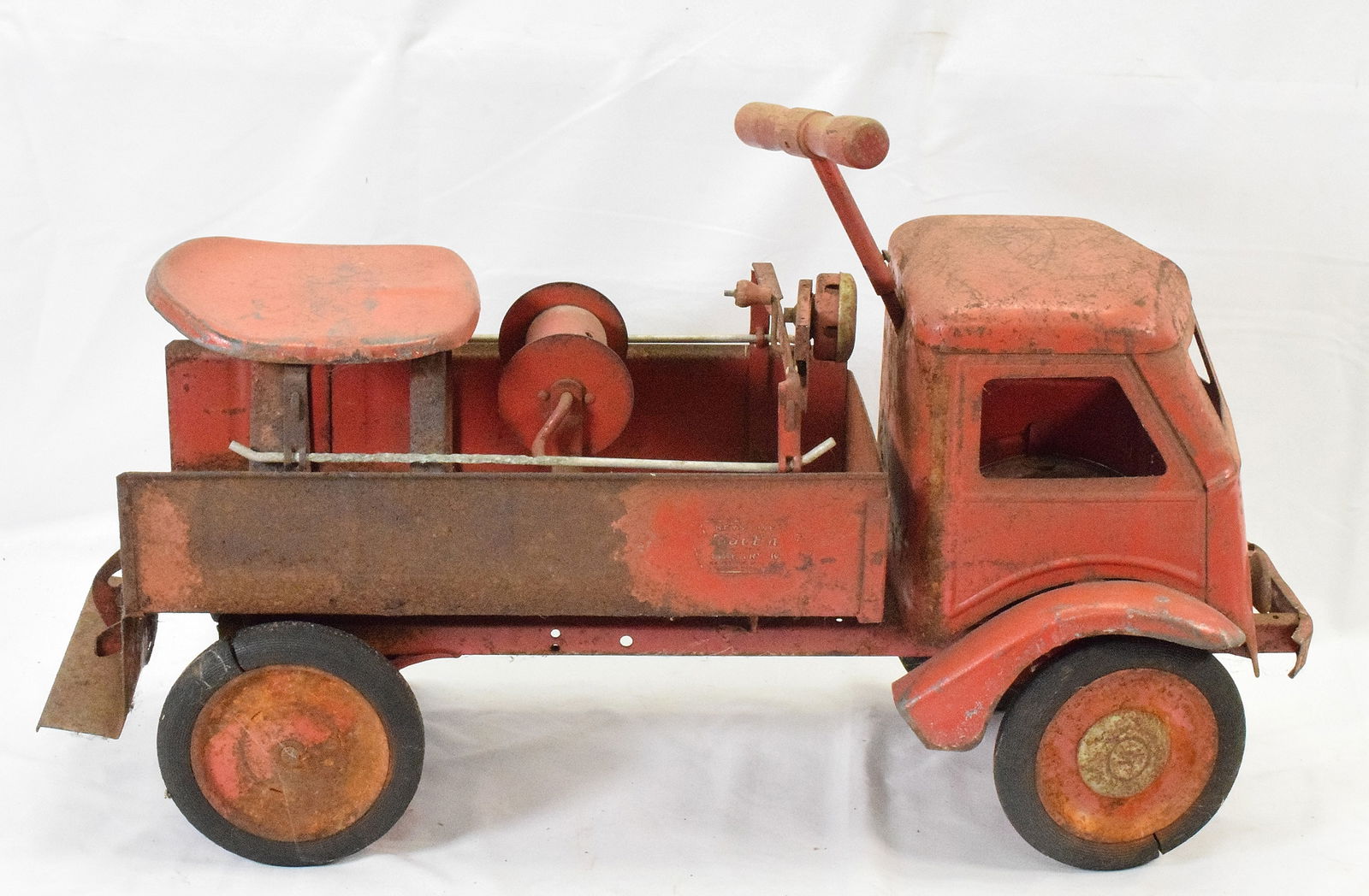 KEYSTONE RIDE 'EM FIRE TRUCK: Original un-restored Keystone Ride on Fire Ladder Truck. Overall poor condition with wear and rust. Seat, handle and bell preseent, Keystone hubcaps. Missing ladders and hose. Measures 27 inches longx