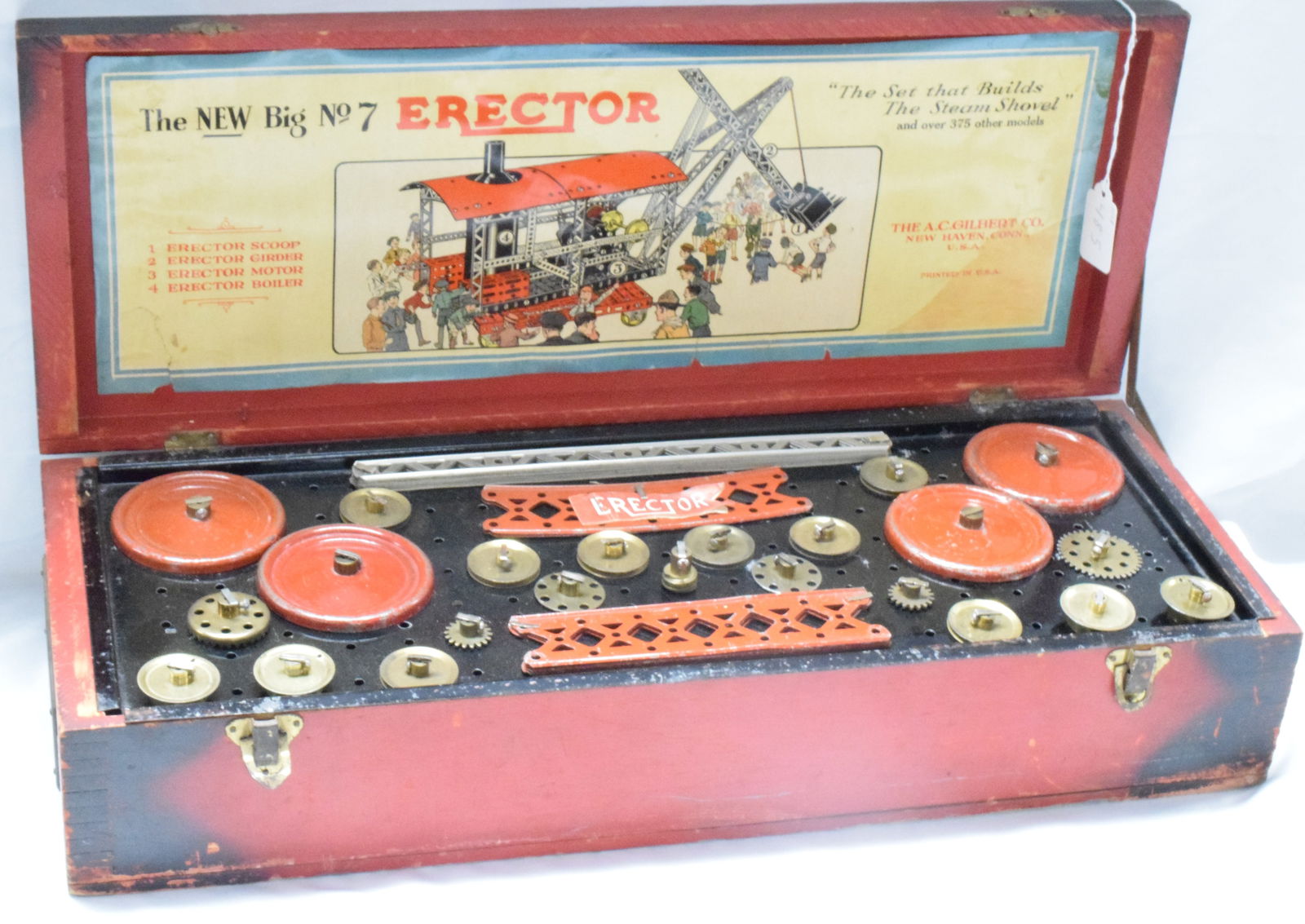 ERECTOR SET #7 THE BIG SHOVEL: Complete Erector set #7 from The A.C Gilbert CO. made in 1931. "The Big Shovel" Label was repaired, wooden red box, original set. Good condition. L: 21 1/2in, W: 8 1/2in, H: 4 1/2in, Weight: 12 lbs.