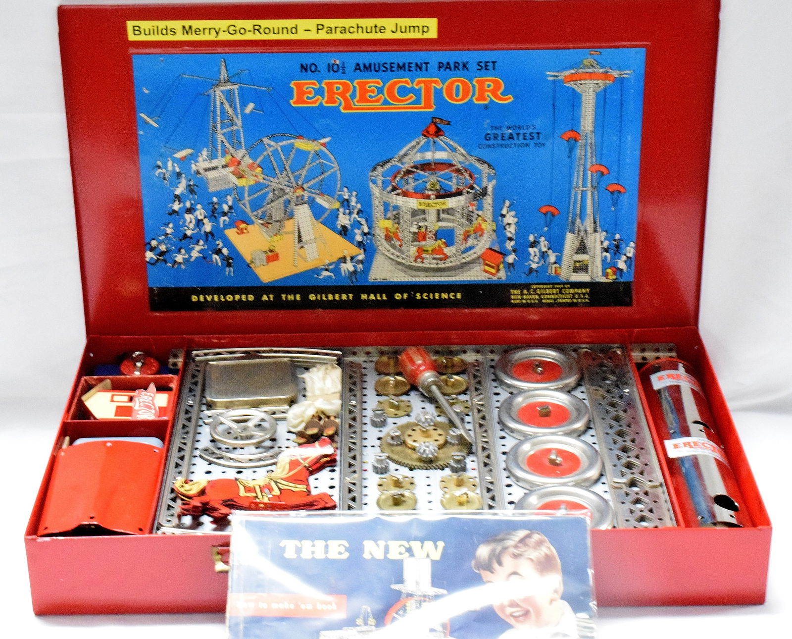 ERECTOR SET #10 1/2 AMUSEMENT PARK: Original amusement park set #10 1/2 made by The A.C Gilbert Company in 1951. Set builds a merry-go-round and parachute jump. Restored red metal box. Good condition. L: 22 1/4in, W: 131/4in, H: 3in, We
