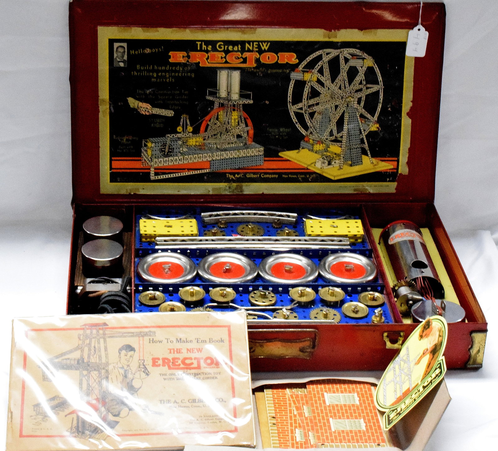ERECTOR SET #7 1/2 FERRIS WHEEL: Complete engineers erector set #7 1/2, made by The A.C Gilbert Company in 1935. Red metal box, original inserts, builds ferris wheel. Good condition. L: 20 1/4in, W: 12in, H: 3in. Weight:19 lbs.